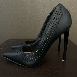 Black stilettos with a fun design around the rim. Have only been worn twice.
